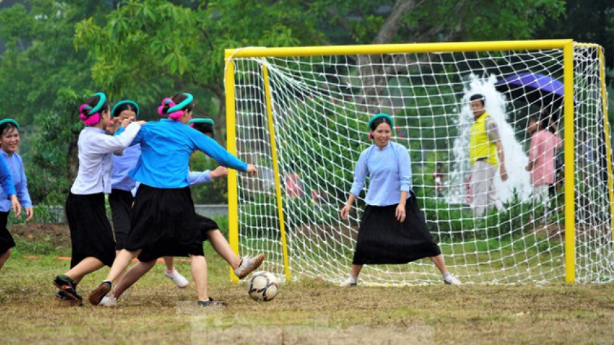 When ethnic women in traditional skirts play football in Vietnam